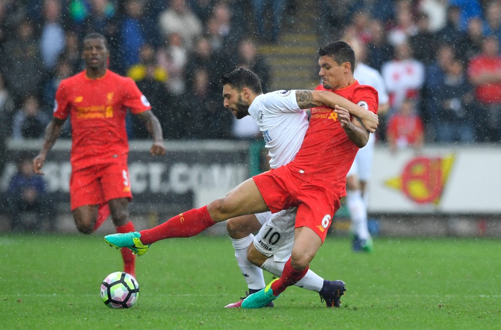 SWANSEA, WALES - OCTOBER 01:  Borja Gonzalez of Swansea City (L) and Dejan Lovren of Liverpool (R) battle for possession during the Premier League match between Swansea City and Liverpool at Liberty Stadium on October 1, 2016 in Swansea, Wales.  (Photo by Stu Forster/Getty Images)