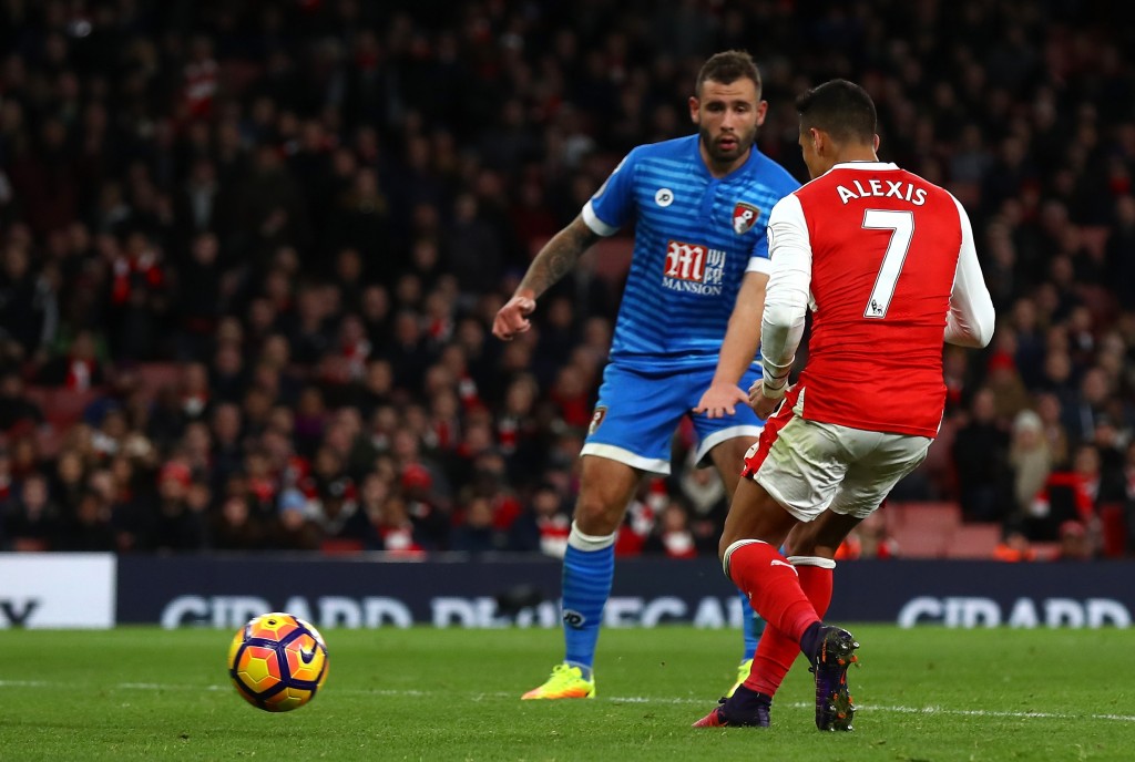 LONDON, ENGLAND - NOVEMBER 27: Alexis Sanchez of Arsenal (R) scores his sides third goal during the Premier League match between Arsenal and AFC Bournemouth at Emirates Stadium on November 27, 2016 in London, England. (Photo by Clive Rose/Getty Images)