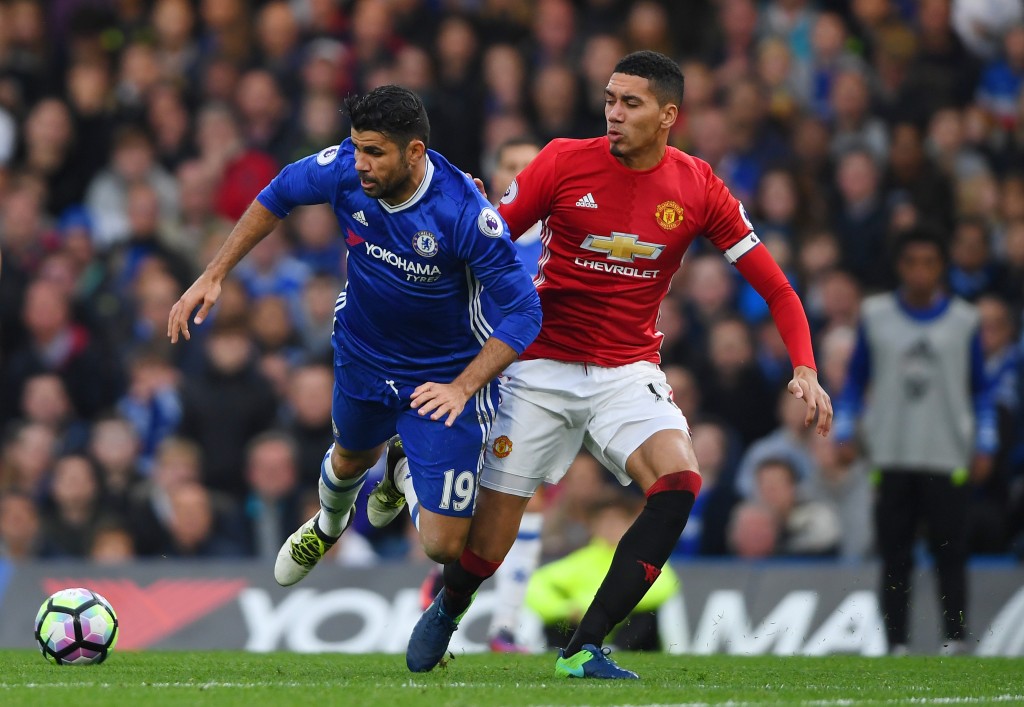 LONDON, ENGLAND - OCTOBER 23: Chris Smalling of Manchester United tackles Diego Costa of Chelsea during the Premier League match between Chelsea and Manchester United at Stamford Bridge on October 23, 2016 in London, England. (Photo by Mike Hewitt/Getty Images)