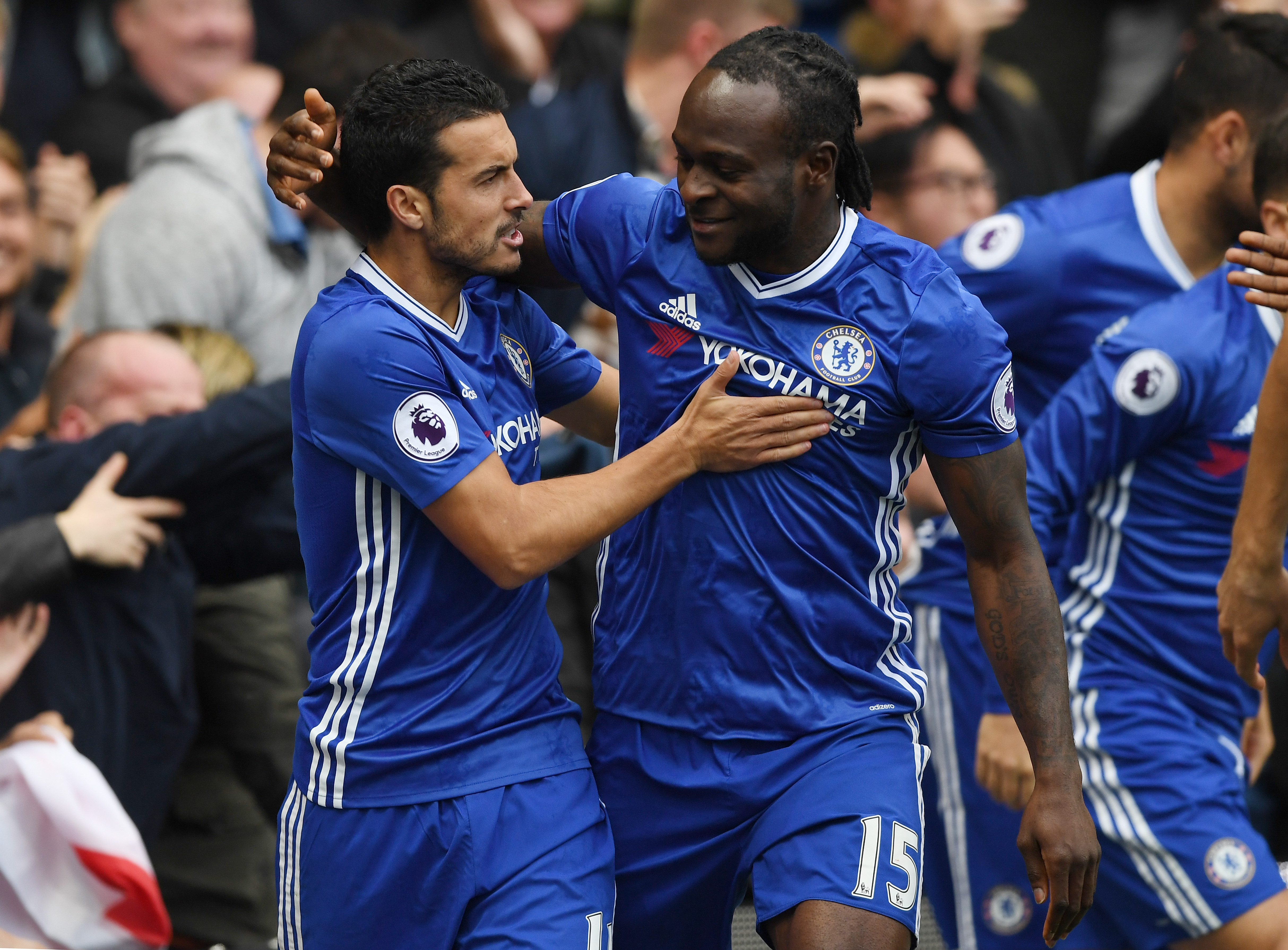 LONDON, ENGLAND - OCTOBER 23: Pedro of Chelsea celebrates scoring his sides first goal with Victor Moses of Chelsea during the Premier League match between Chelsea and Manchester United at Stamford Bridge on October 23, 2016 in London, England. (Photo by Shaun Botterill/Getty Images)