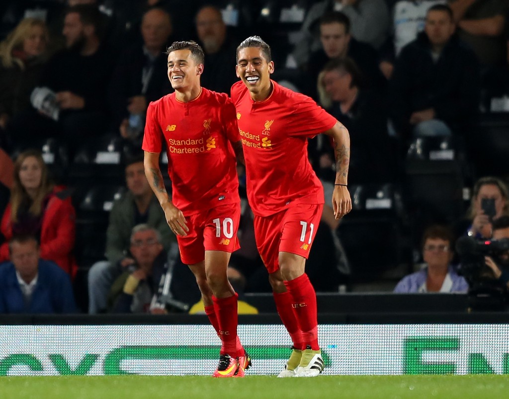 DERBY, ENGLAND - SEPTEMBER 20: Philippe Coutinho (L) of Liverpool celebrates scoring his team's second goal with Roberto Firmino during the EFL Cup Third Round match between Derby County and Liverpool at iPro Stadium on September 20, 2016 in Derby, England. (Photo by Richard Heathcote/Getty Images)