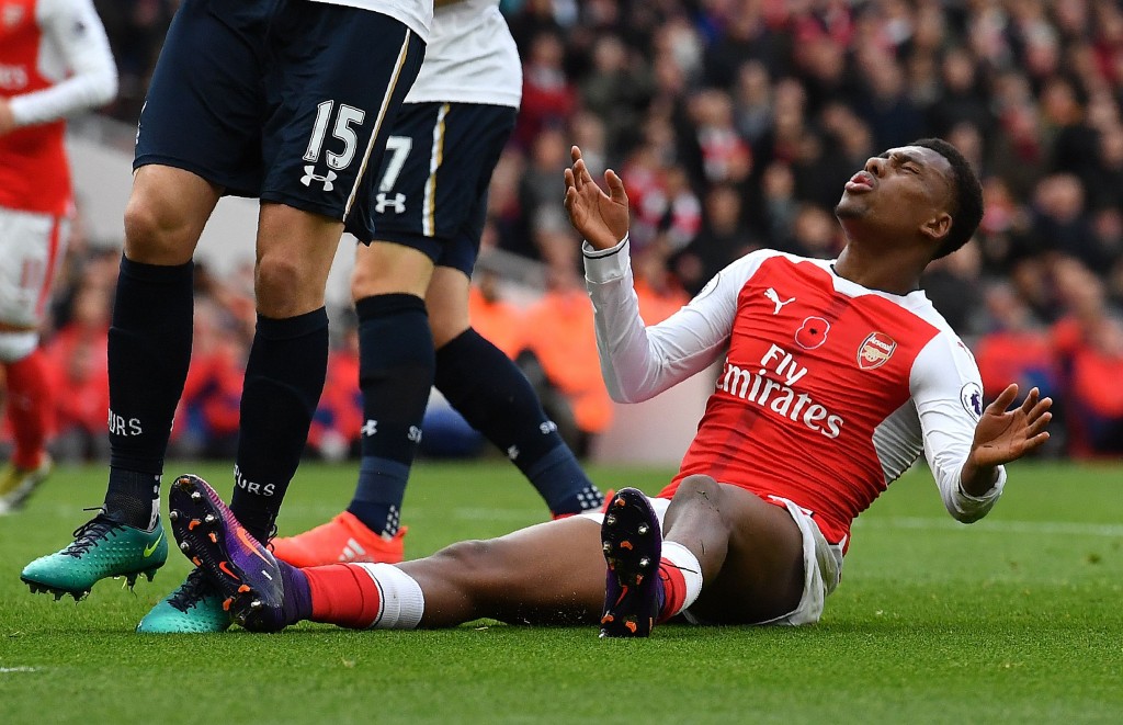 Arsenal's Nigerian striker Alex Iwobi reacts after missing a shot on goal during the English Premier League football match between Arsenal and Tottenham Hotspur at the Emirates Stadium in London on November 6, 2016. (Photo by Ben Stansall/AFP/Getty Images)