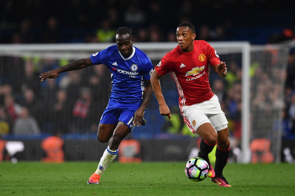 Manchester United's French striker Anthony Martial (R) takes on Chelsea's Nigerian midfielder Victor Moses (L) during the English Premier League football match between Chelsea and Manchester United at Stamford Bridge in London on October 23, 2016. / AFP / BEN STANSALL / RESTRICTED TO EDITORIAL USE. No use with unauthorized audio, video, data, fixture lists, club/league logos or 'live' services. Online in-match use limited to 75 images, no video emulation. No use in betting, games or single club/league/player publications. / (Photo credit should read BEN STANSALL/AFP/Getty Images)