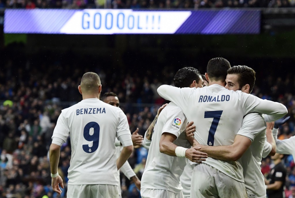 Real Madrid's Portuguese forward Cristiano Ronaldo (2nd R) celebrates with teammates his second goal during the Spanish league football match Real Madrid CF vs Real Sporting de Gijon at the Santiago Bernabeu stadium in Madrid on November 26, 2016. / AFP / JAVIER SORIANO (Photo credit should read JAVIER SORIANO/AFP/Getty Images)