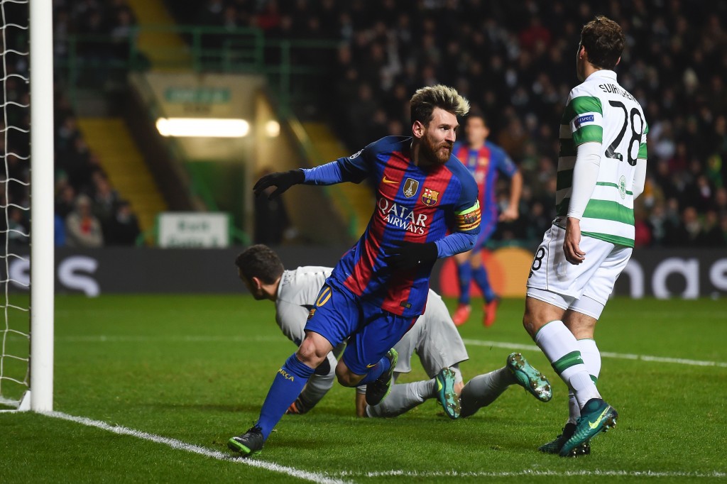 Barcelona's Argentinian striker Lionel Messi (C) celebrates scoring the opening goal during the UEFA Champions League group C football match between Celtic and Barcelona at Celtic Park in Glasgow on November 23, 2016. / AFP / Paul ELLIS (Photo credit should read PAUL ELLIS/AFP/Getty Images)