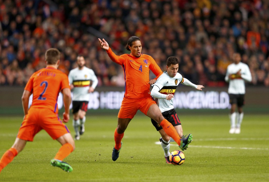 Dutch national football team player Virgil van Dijk (C) vies with Eden Hazard (R) of Belgium during a friendly football match between The Netherlands and Belgium at the Amsterdam Arena in Amsterdam on November 9, 2016. / AFP / ANP / Jerry Lampen / Netherlands OUT (Photo credit should read JERRY LAMPEN/AFP/Getty Images)