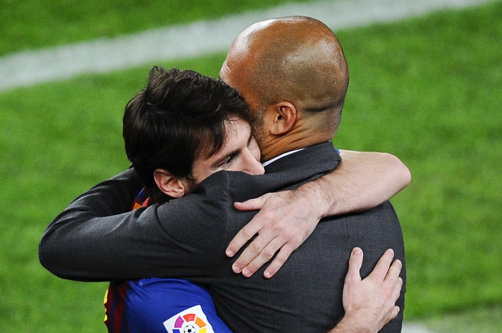 BARCELONA, SPAIN - MAY 05: Lionel Messi of FC Barcelona (L) hugs his Head coach Josep Guardiola of FC Barcelona after scoring his team's third goal during the La Liga match between FC Barcelona and RCD Espanyol at Camp Nou on May 5, 2012 in Barcelona, Spain. This was Guardiola's last match. (Photo by David Ramos/Getty Images)