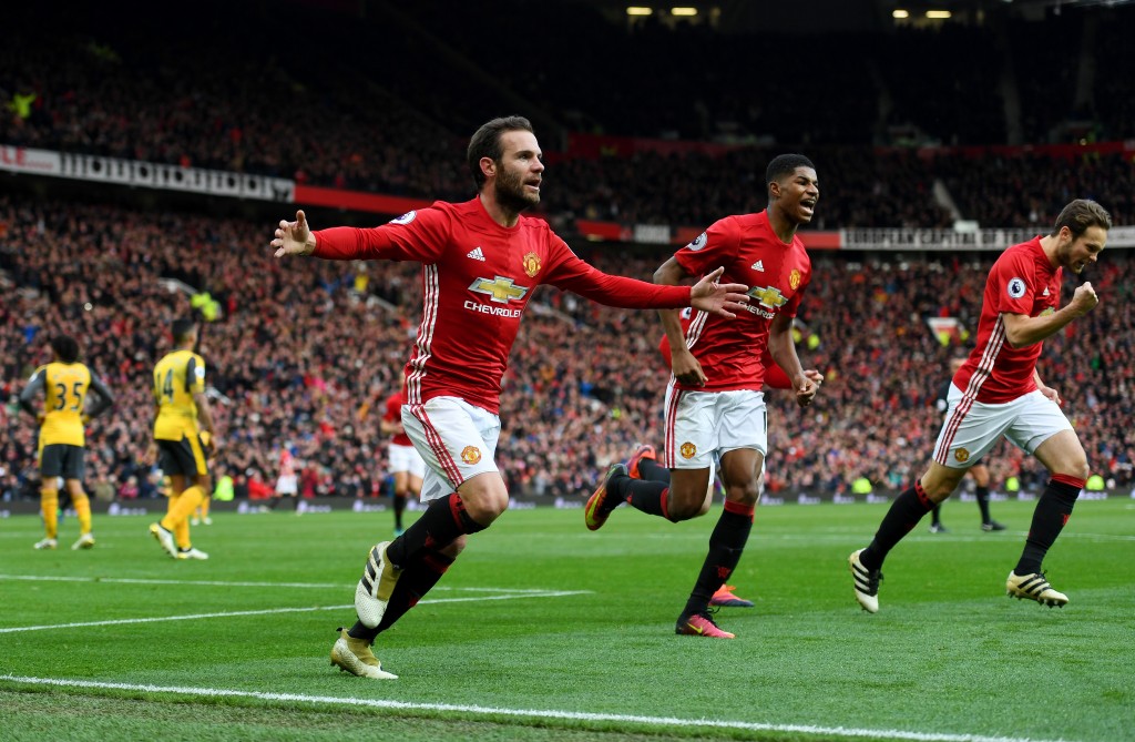 MANCHESTER, ENGLAND - NOVEMBER 19: Juan Mata of Manchester United (L) celebrates scoring his sides first goal during the Premier League match between Manchester United and Arsenal at Old Trafford on November 19, 2016 in Manchester, England. (Photo by Shaun Botterill/Getty Images)