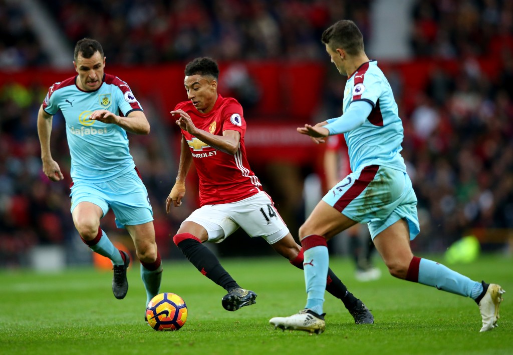 MANCHESTER, ENGLAND - OCTOBER 29: Jesse Lingard of Manchester United (C) takes the ball past Dean Marney of Burnley (L) during the Premier League match between Manchester United and Burnley at Old Trafford on October 29, 2016 in Manchester, England. (Photo by Alex Livesey/Getty Images)