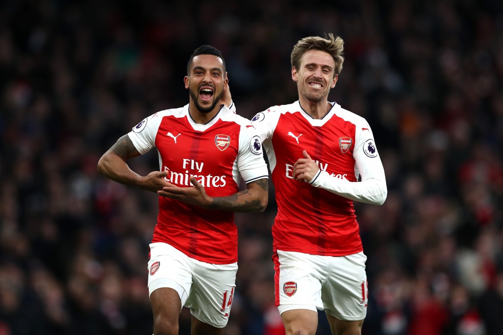 LONDON, ENGLAND - NOVEMBER 27: Theo Walcott of Arsenal (L) celebrates scoring his sides second goal with Nacho Monreal of Arsenal (R) during the Premier League match between Arsenal and AFC Bournemouth at Emirates Stadium on November 27, 2016 in London, England. (Photo by Clive Rose/Getty Images)