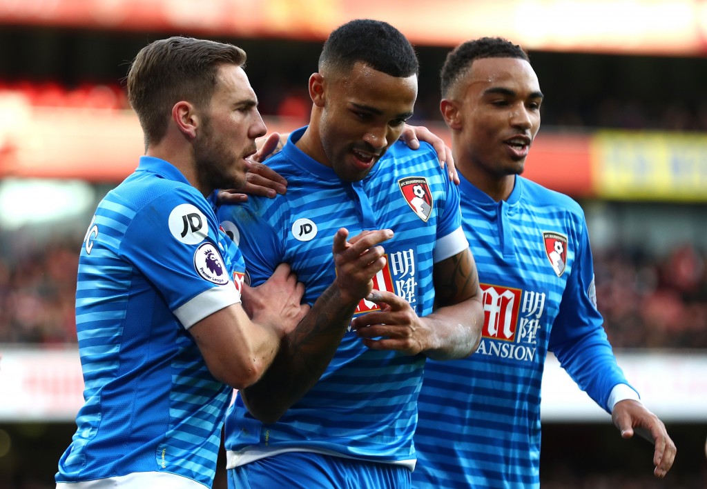 LONDON, ENGLAND - NOVEMBER 27: Callum Wilson of AFC Bournemouth (C) celebrates scoring his sides first goal with Dan Gosling of AFC Bournemouth (L) and Junior Stanislas of AFC Bournemouth (R) during the Premier League match between Arsenal and AFC Bournemouth at Emirates Stadium on November 27, 2016 in London, England. (Photo by Clive Rose/Getty Images)