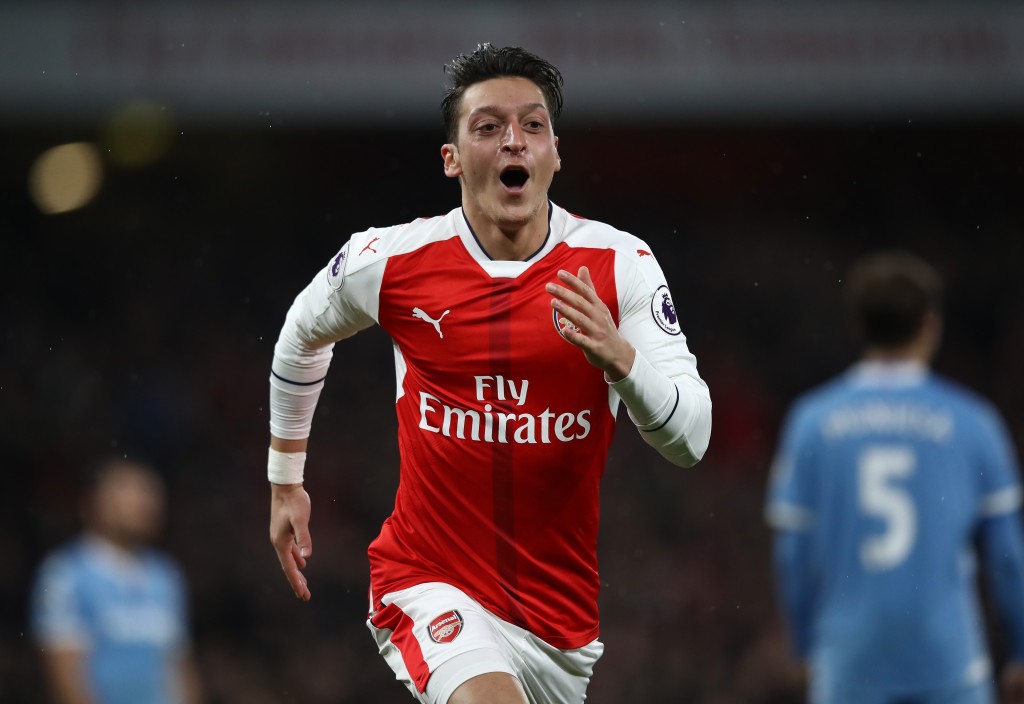 LONDON, ENGLAND - DECEMBER 10: Mesut Ozil of Arsenal celebrates scoring his sides second goal during the Premier League match between Arsenal and Stoke City at the Emirates Stadium on December 10, 2016 in London, England. (Photo by Julian Finney/Getty Images)