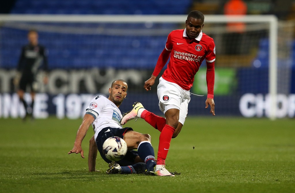 BOLTON, ENGLAND - APRIL 19: Ademola Lookman of Charlton Athletic is tackled by Darren Pratley of Bolton Wanderers during the Sky Bet Championship match between Bolton Wanderers and Charlton Athletic at Reebok Stadium on April 19, 2016 in Bolton, United Kingdom. (Photo by Jan Kruger/Getty Images)