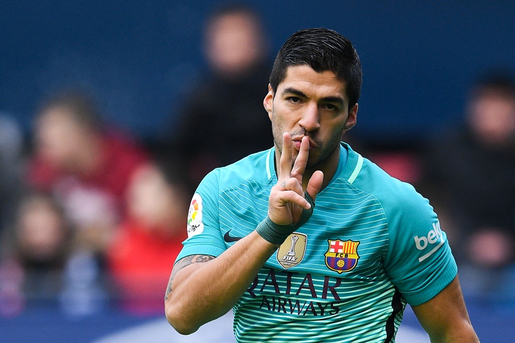 Suarez busts out his trademark celebration as he gives Barcelona the lead. (Picture Courtesy - AFP/Getty Images)