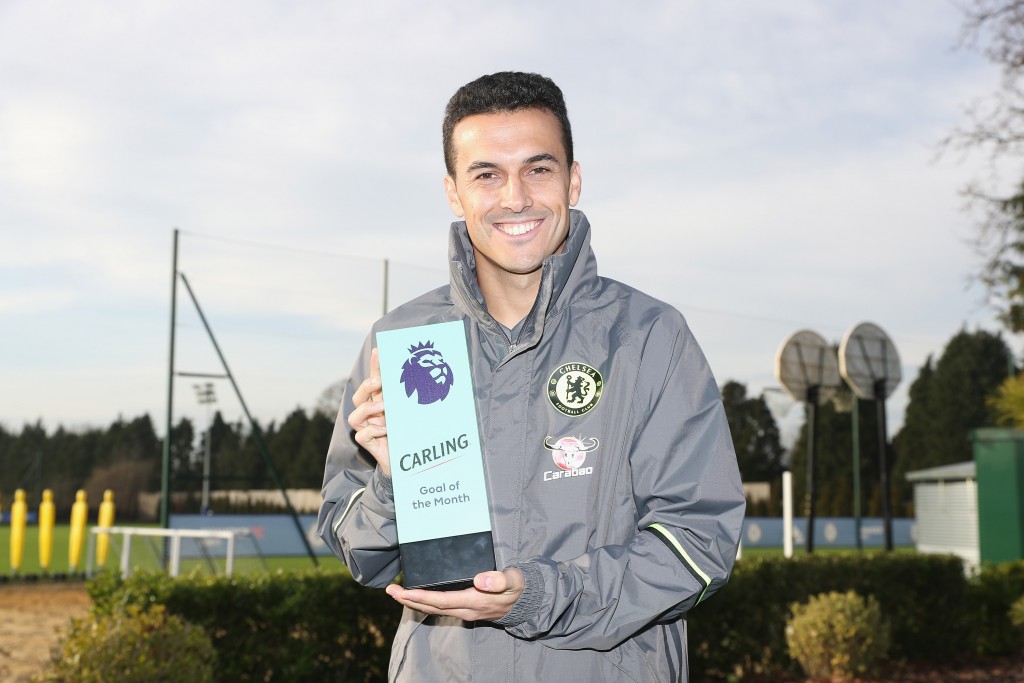 COBHAM, ENGLAND - DECEMBER 09: Pedro of Chelsea poses with his Goal of the Month award as Chelsea receive the Monthly Premier League Awards at Chelsea Training Ground on December 9, 2016 in Cobham, England. (Photo by Christopher Lee/Getty Images for Premier League)