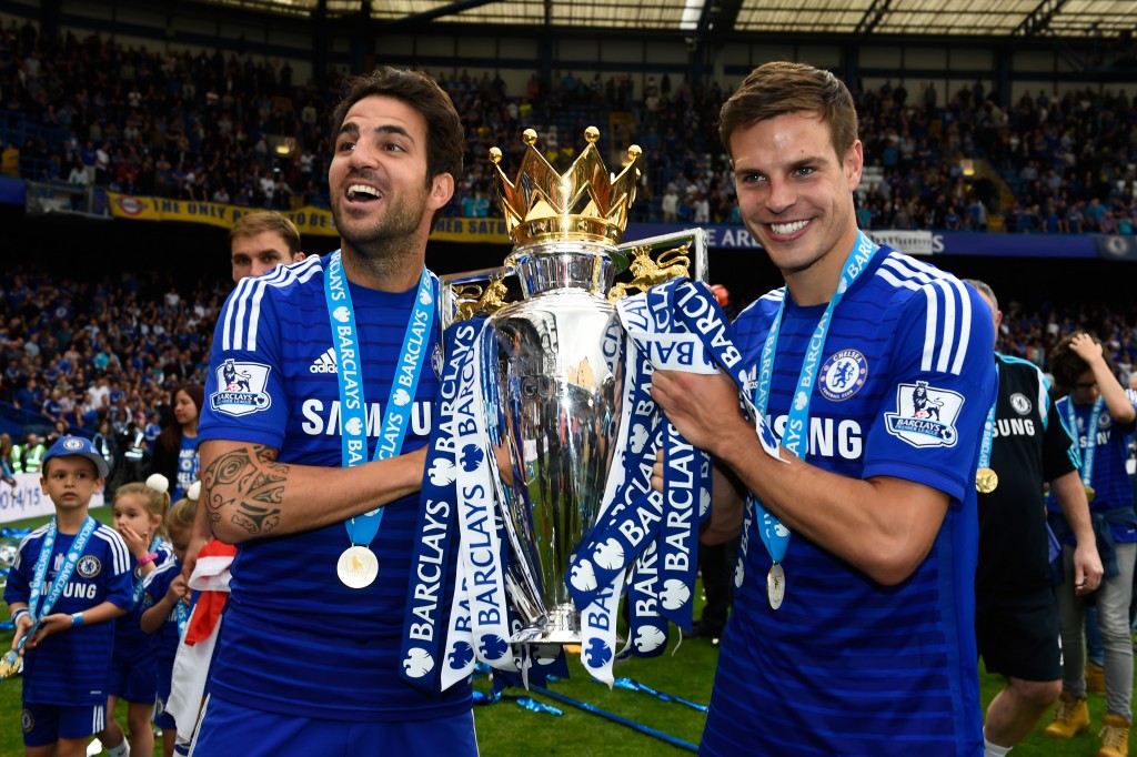 LONDON, ENGLAND - MAY 24: Cesc Fabregas and Cesar Azpilicueta of Chelsea celebrate with the trophy after the Barclays Premier League match between Chelsea and Sunderland at Stamford Bridge on May 24, 2015 in London, England. Chelsea were crowned Premier League champions. (Photo by Mike Hewitt/Getty Images)