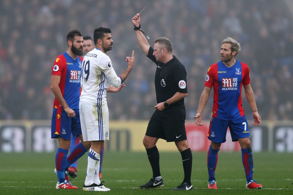 LONDON, ENGLAND - DECEMBER 17: Diego Costa of Chelsea (L) is shown a yellow card by Referee Jonathan Moss (C) during the Premier League match between Crystal Palace and Chelsea at Selhurst Park on December 17, 2016 in London, England. (Photo by Clive Rose/Getty Images)
