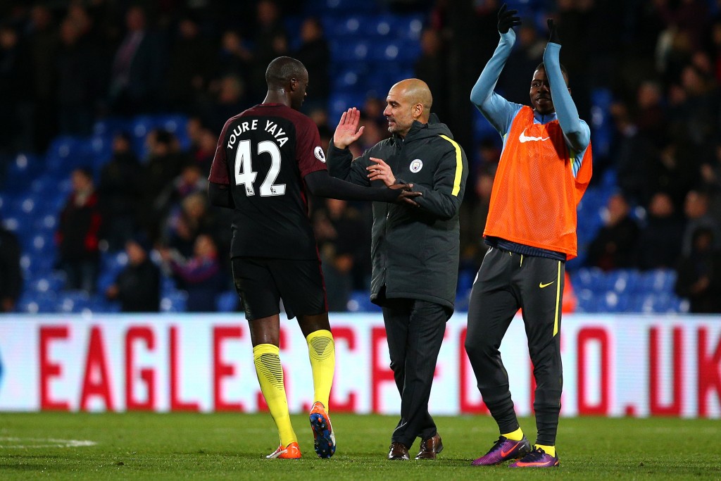 LONDON, ENGLAND - NOVEMBER 19: Man City's Manager Pep Guardiola celebrates the teams win with Yaya Toure after the whistle during the Premier League match between Crystal Palace and Manchester City at Selhurst Park on November 19, 2016 in London, England. (Photo by Charlie Crowhurst/Getty Images)