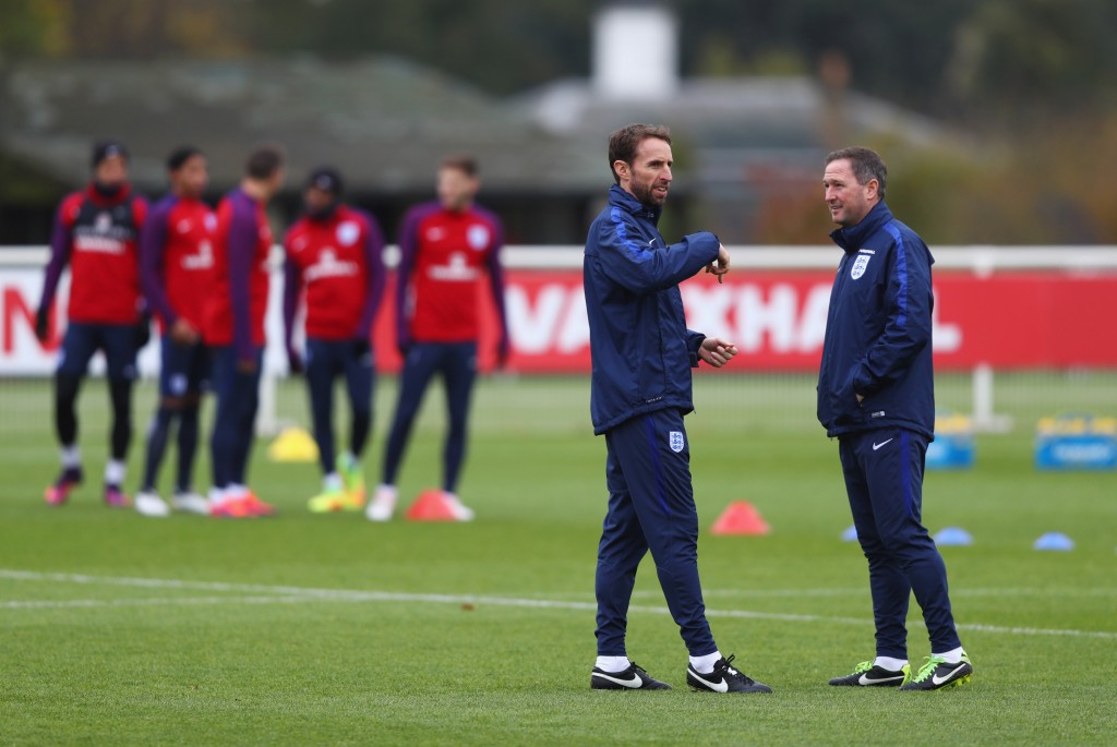 ENFIELD, ENGLAND - NOVEMBER 14: Gareth Southgate interim manager of England and assistant Steve Holland in discussion during an England training session on the eve of their international friendly match against Spain at Tottenham Hotspur Training Centre on November 14, 2016 in Enfield, England. (Photo by Clive Rose/Getty Images)