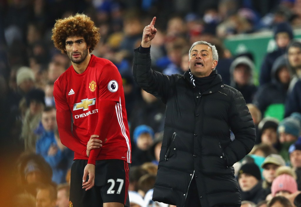 LIVERPOOL, ENGLAND - DECEMBER 04: Jose Mourinho manager of Manchester United stands alongside substitute Marouane Fellaini of Manchester United during the Premier League match between Everton and Manchester United at Goodison Park on December 4, 2016 in Liverpool, England. (Photo by Clive Brunskill/Getty Images)