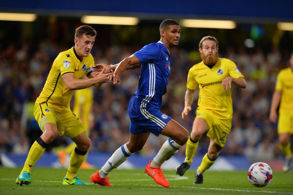 Chelsea's English midfielder Ruben Loftus-Cheek (C) runs with the ball challenged by Bristol Rovers' English midfielder Stuart Sinclair (R) during the English League Cup second round football match between Chelsea and Bristol Rovers at Stamford Bridge in London on August 23, 2016. / AFP / GLYN KIRK / RESTRICTED TO EDITORIAL USE. No use with unauthorized audio, video, data, fixture lists, club/league logos or 'live' services. Online in-match use limited to 75 images, no video emulation. No use in betting, games or single club/league/player publications. / (Photo credit should read GLYN KIRK/AFP/Getty Images)