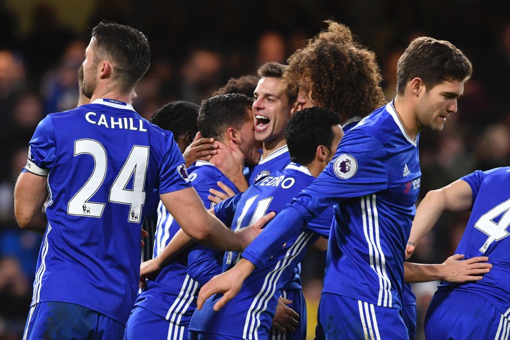 Chelsea's Belgian midfielder Eden Hazard (CL) celebrates with team-mates after scoring their second goal from teh penalty spot during the English Premier League football match between Chelsea and Bournemouth at Stamford Bridge in London on December 26, 2016. (Photo by Ben Stansall/AFP/Getty Images)