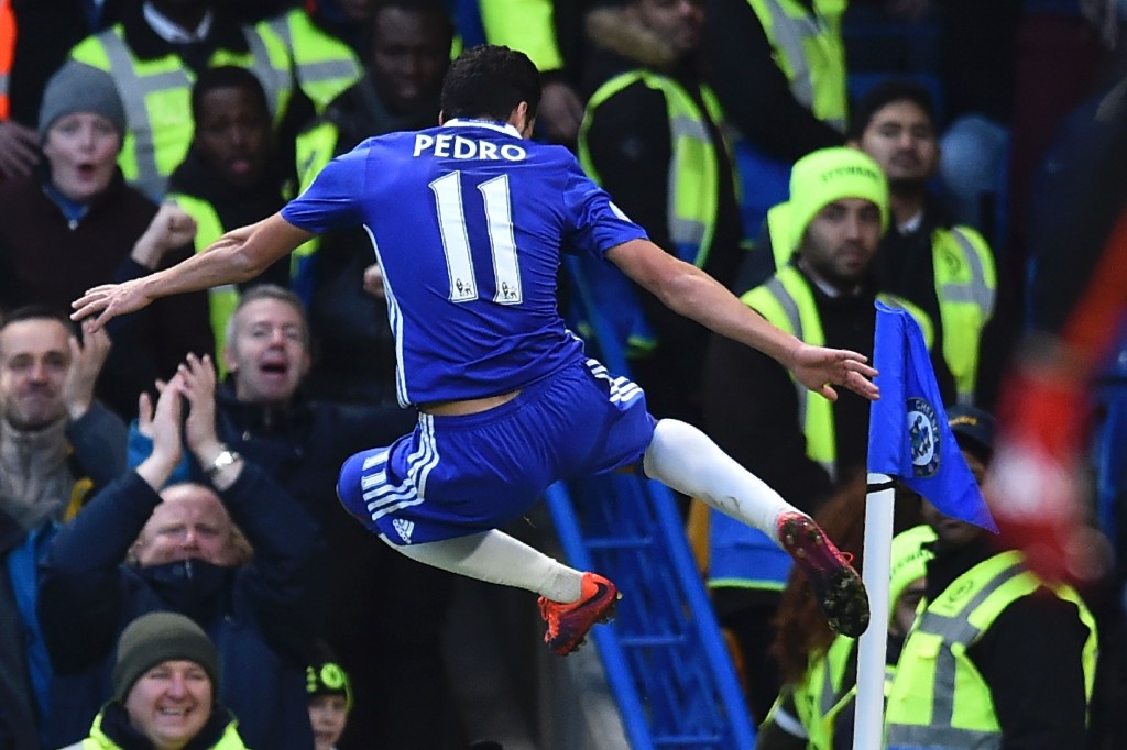 Chelsea's Spanish midfielder Pedro celebrates scoring the opening goal during the English Premier League football match between Chelsea and Bournemouth at Stamford Bridge in London on December 26, 2016. (Photo by Glyn Kirk/AFP/Getty Images)