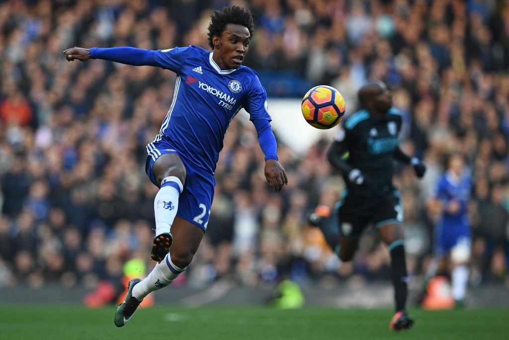 Chelsea's Brazilian midfielder Willian runs with the ball during the English Premier League football match between Chelsea and West Bromwich Albion at Stamford Bridge in London on December 11, 2016. Chelsea won the game 1-0. / AFP / Justin TALLIS / RESTRICTED TO EDITORIAL USE. No use with unauthorized audio, video, data, fixture lists, club/league logos or 'live' services. Online in-match use limited to 75 images, no video emulation. No use in betting, games or single club/league/player publications. / (Photo credit should read JUSTIN TALLIS/AFP/Getty Images)
