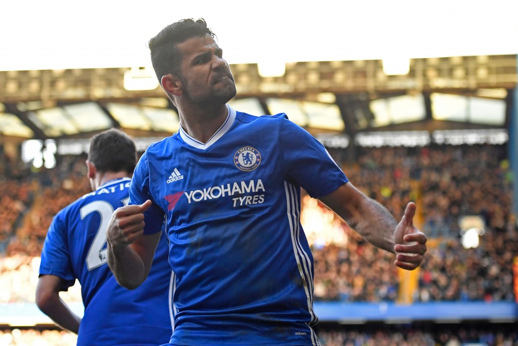 Chelsea's Brazilian-born Spanish striker Diego Costa celebrates after scoring the opening goal of the English Premier League football match between Chelsea and West Bromwich Albion at Stamford Bridge in London on December 11, 2016. (Photo by Justin Tallis/AFP/Getty Images)