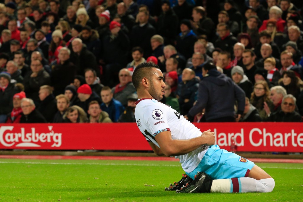West Ham United's French midfielder Dimitri Payet celebrates after scoring their first goal during the English Premier League football match between Liverpool and West Ham United at Anfield in Liverpool, north west England on December 11, 2016. / AFP / Lindsey PARNABY / RESTRICTED TO EDITORIAL USE. No use with unauthorized audio, video, data, fixture lists, club/league logos or 'live' services. Online in-match use limited to 75 images, no video emulation. No use in betting, games or single club/league/player publications. / (Photo credit should read LINDSEY PARNABY/AFP/Getty Images)