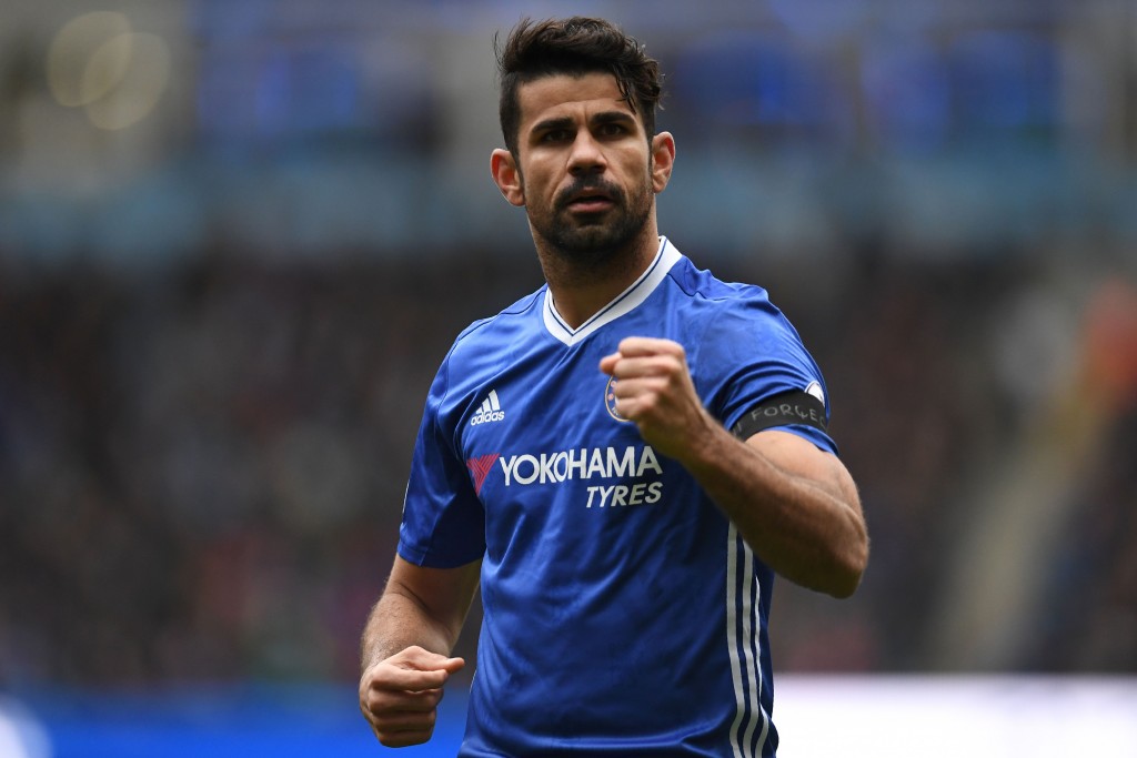 Chelsea's Brazilian-born Spanish striker Diego Costa celebrates scoring his team's first goal during the English Premier League football match between Manchester City and Chelsea at the Etihad Stadium in Manchester, north west England, on December 3, 2016. / AFP / Paul ELLIS / RESTRICTED TO EDITORIAL USE. No use with unauthorized audio, video, data, fixture lists, club/league logos or 'live' services. Online in-match use limited to 75 images, no video emulation. No use in betting, games or single club/league/player publications. / (Photo credit should read PAUL ELLIS/AFP/Getty Images)
