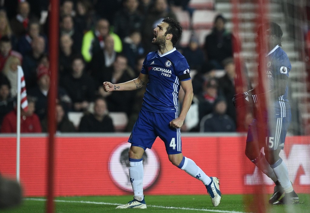 Chelsea's Spanish midfielder Cesc Fabregas celebrates scoring his team's first goal during the English Premier League football match between Sunderland and Chelsea at the Stadium of Light in Sunderland, north-east England on December 14, 2016. / AFP / Oli SCARFF / RESTRICTED TO EDITORIAL USE. No use with unauthorized audio, video, data, fixture lists, club/league logos or 'live' services. Online in-match use limited to 75 images, no video emulation. No use in betting, games or single club/league/player publications. / (Photo credit should read OLI SCARFF/AFP/Getty Images)