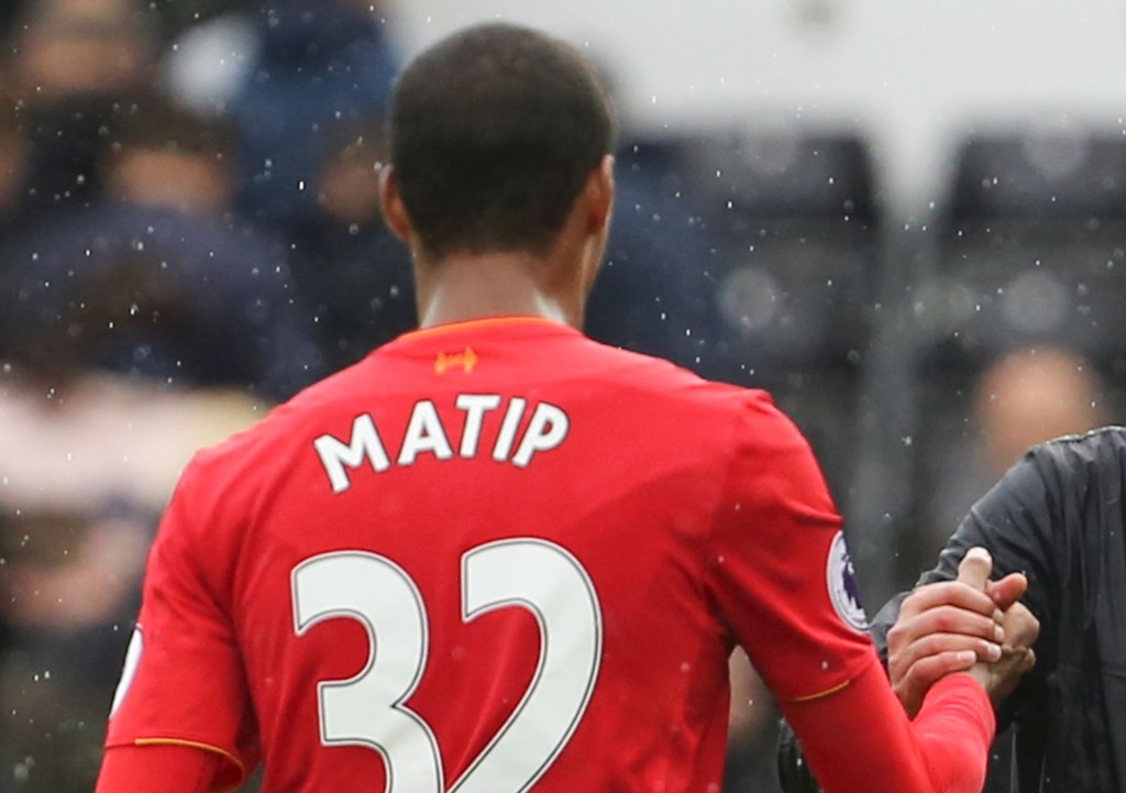 Liverpool's German manager Jurgen Klopp (R) shakes hands with Liverpool's German-born Cameroonian defender Joel Matip (L) at the end of the English Premier League football match between Swansea City and Liverpool at The Liberty Stadium in Swansea, south Wales on October 1, 2016.(Photo by Geoff Caddick/AFP/Getty Images)