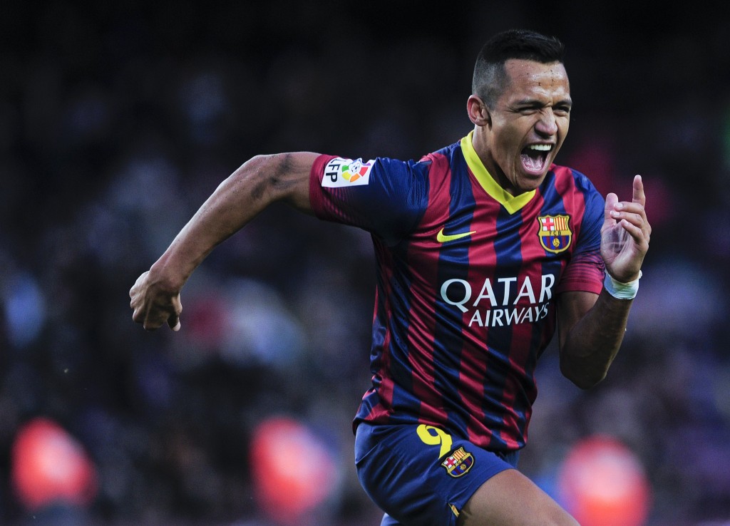 Barcelona's Chilean forward Alexis Sanchez celebrates after scoring his third goal during the Spanish league football match FC Barcelona vs Elche CF at the Camp Nou stadium in Barcelona on January 5, 2014. AFP PHOTO/ JOSEP LAGO (Photo credit should read JOSEP LAGO/AFP/Getty Images)