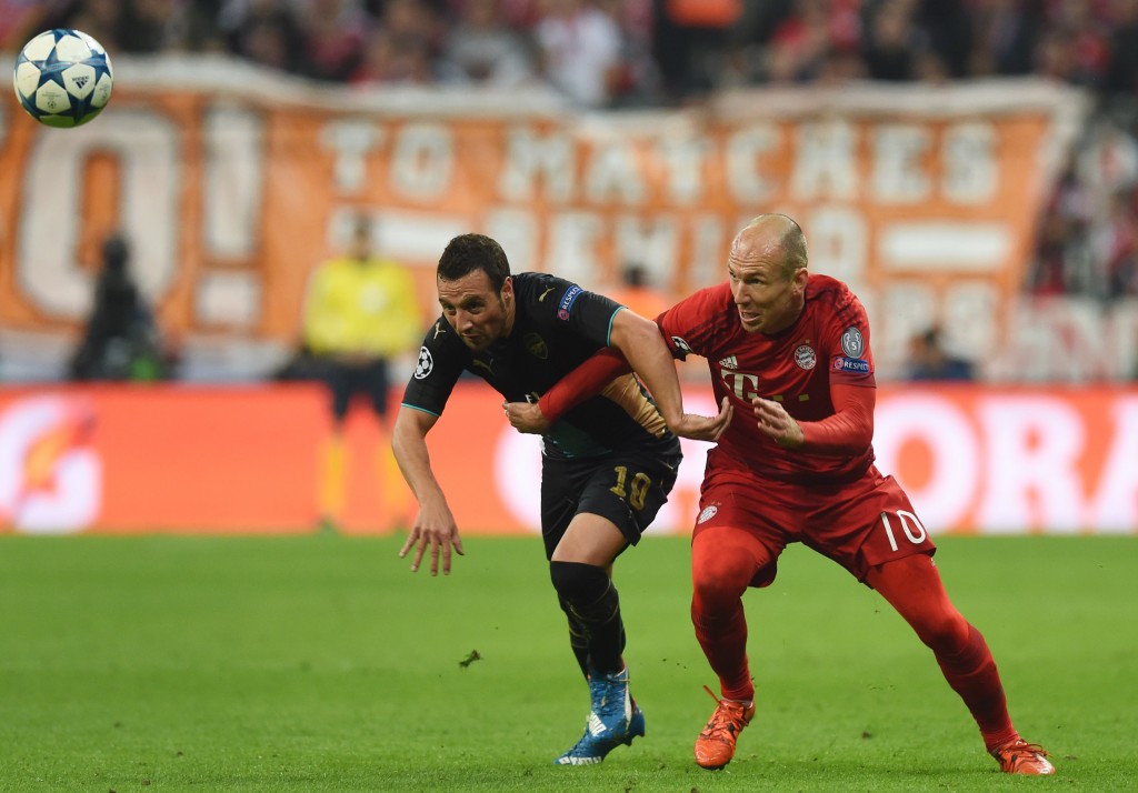 Bayern Munich's Dutch midfielder Arjen Robben (R) and Arsenal's Spanish midfielder Santi Cazorla vie for the ball during the UEFA Champions League Group F second-leg football match between FC Bayern Munich and Arsenal FC in Munich, southern Germany, on November 4, 2015. Bayern won the match 5-1. (Photo by Christof Stache/AFP/Getty Images)