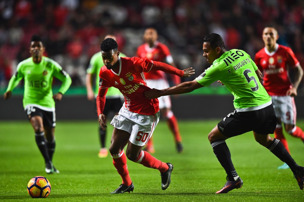 Benfica's defender Nelson Semedo (L) vies with Rio Ave's Brazilian midfielder Filipe Augusto during the Portuguese league football match SL Benfica vs Rio Ave FC at the Luz stadium in Lisbon on December 21, 2016. (Photo by Patricia De Melo Moreira/AFP/Getty Images)