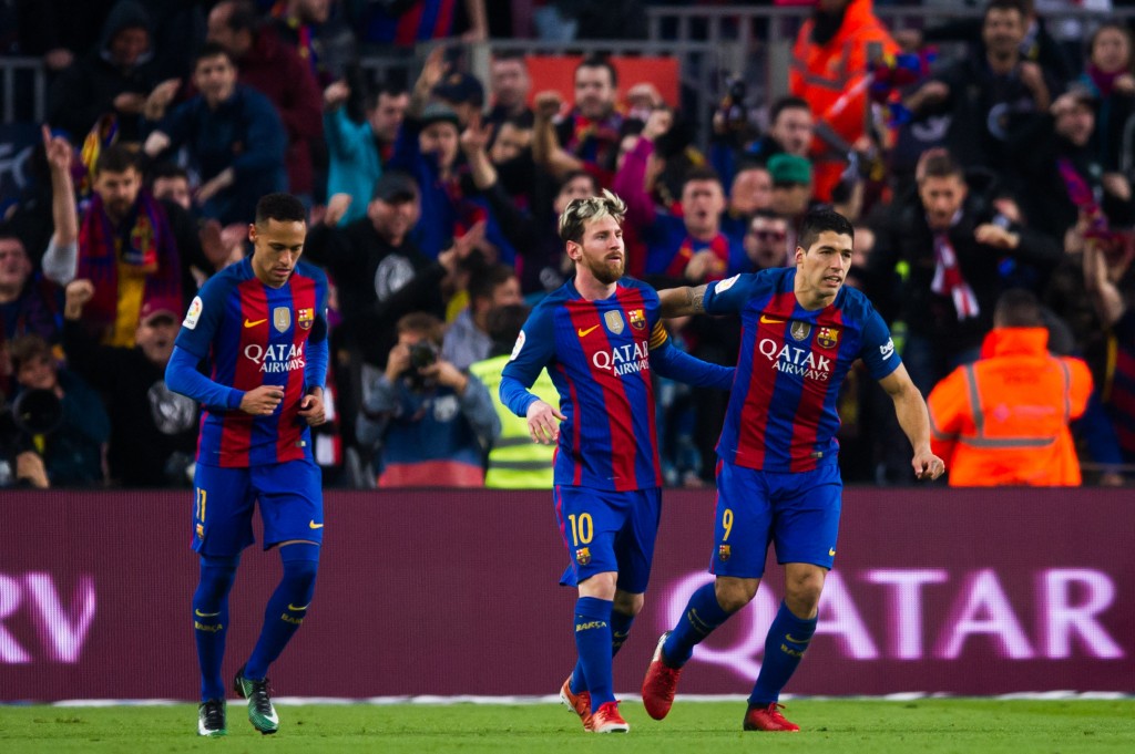 BARCELONA, SPAIN - DECEMBER 03: Luis Suarez (R) of FC Barcelona celebrates with his teammates Neymar Santos Jr (L) and Lionel Messi (C) after scoring the opening goal during the La Liga match between FC Barcelona and Real Madrid CF at Camp Nou stadium on December 3, 2016 in Barcelona, Spain. (Photo by Alex Caparros/Getty Images)