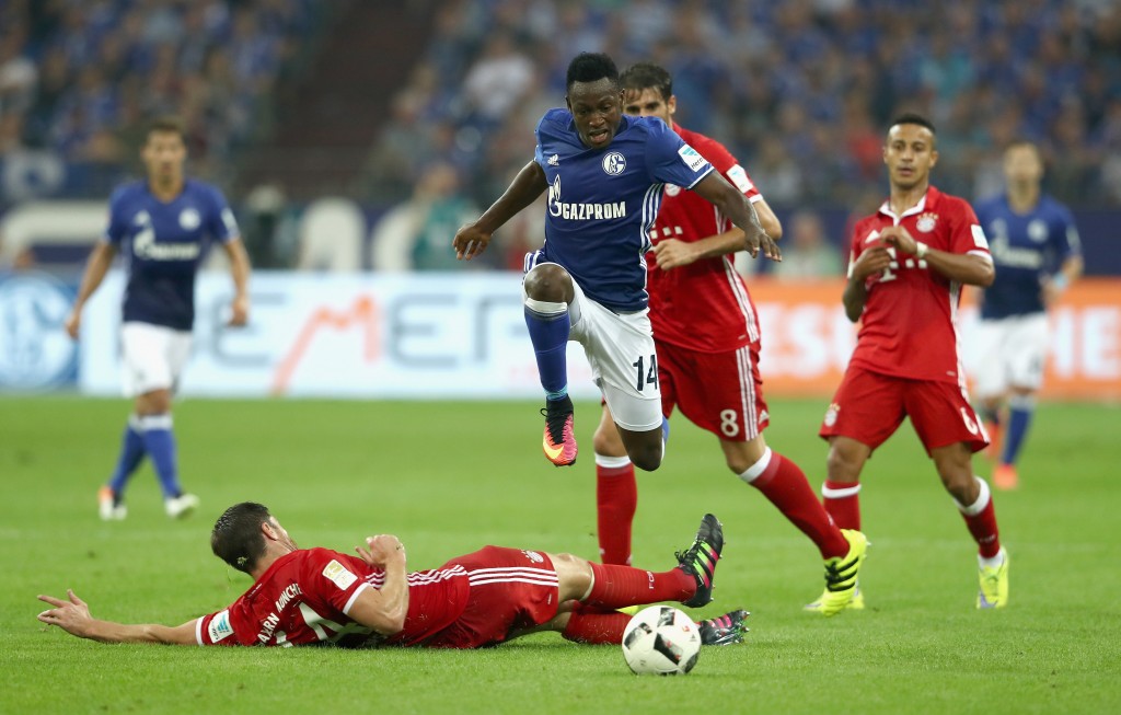 GELSENKIRCHEN, GERMANY - SEPTEMBER 09: Baba Rahman of Schalke jumps over a tackle from Xabi Alonso of Bayern Muenchen during the Bundesliga match between FC Schalke 04 and Bayern Muenchen at Veltins-Arena on September 9, 2016 in Gelsenkirchen, Germany. (Photo by Alex Grimm/Bongarts/Getty Images)