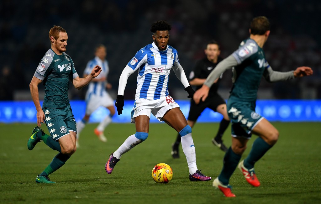 HUDDERSFIELD, ENGLAND - NOVEMBER 28: Kasey Palmer of Huddersfield gets past Shaun MacDonald of Wigan during the Sky Bet Championship match between Huddersfield Town and Wigan Athletic at John Smith's Stadium on November 28, 2016 in Huddersfield, England. (Photo by Gareth Copley/Getty Images)