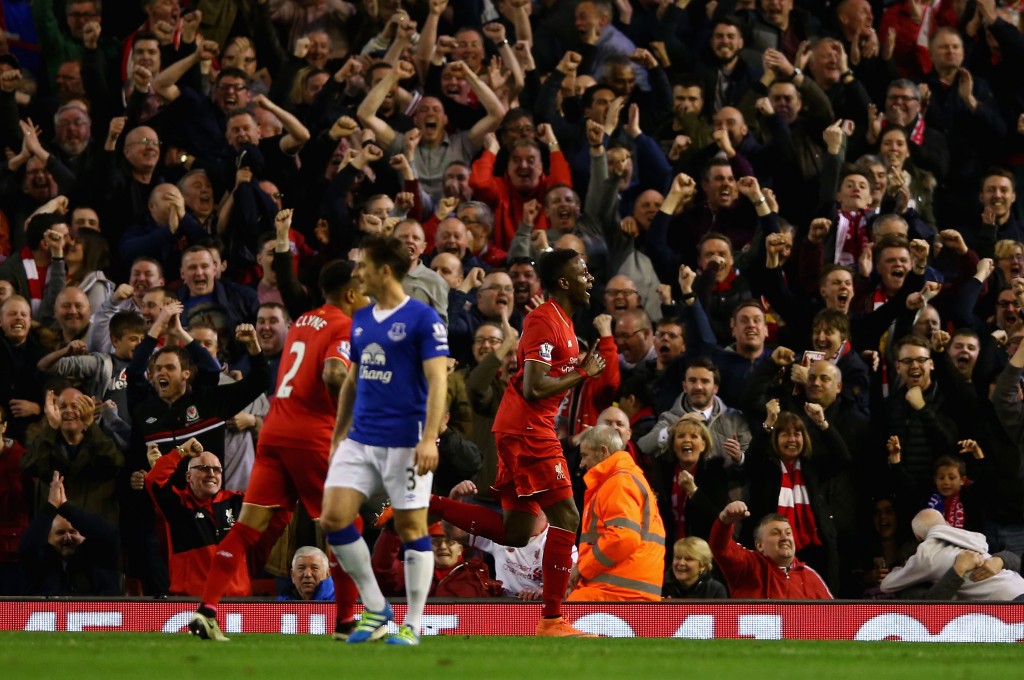 LIVERPOOL, ENGLAND - APRIL 20: Divock Origi of Liverpool celebrates scoring the opening goal during the Barclays Premier League match between Liverpool and Everton at Anfield, April 20, 2016, Liverpool, England (Photo by Clive Brunskill/Getty Images)
