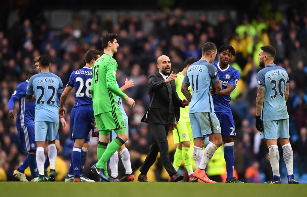 MANCHESTER, ENGLAND - DECEMBER 03: Josep Guardiola tries to calm down players after David Luiz of Chelsea is fouled by Sergio Aguero of Manchester City during the Premier League match between Manchester City and Chelsea at Etihad Stadium on December 3, 2016 in Manchester, England. (Photo by Laurence Griffiths/Getty Images)