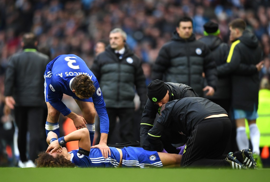 MANCHESTER, ENGLAND - DECEMBER 03: David Luiz of Chelsea receives a medical treatment after fouled by Sergio Aguero of Manchester City during the Premier League match between Manchester City and Chelsea at Etihad Stadium on December 3, 2016 in Manchester, England. (Photo by Laurence Griffiths/Getty Images)