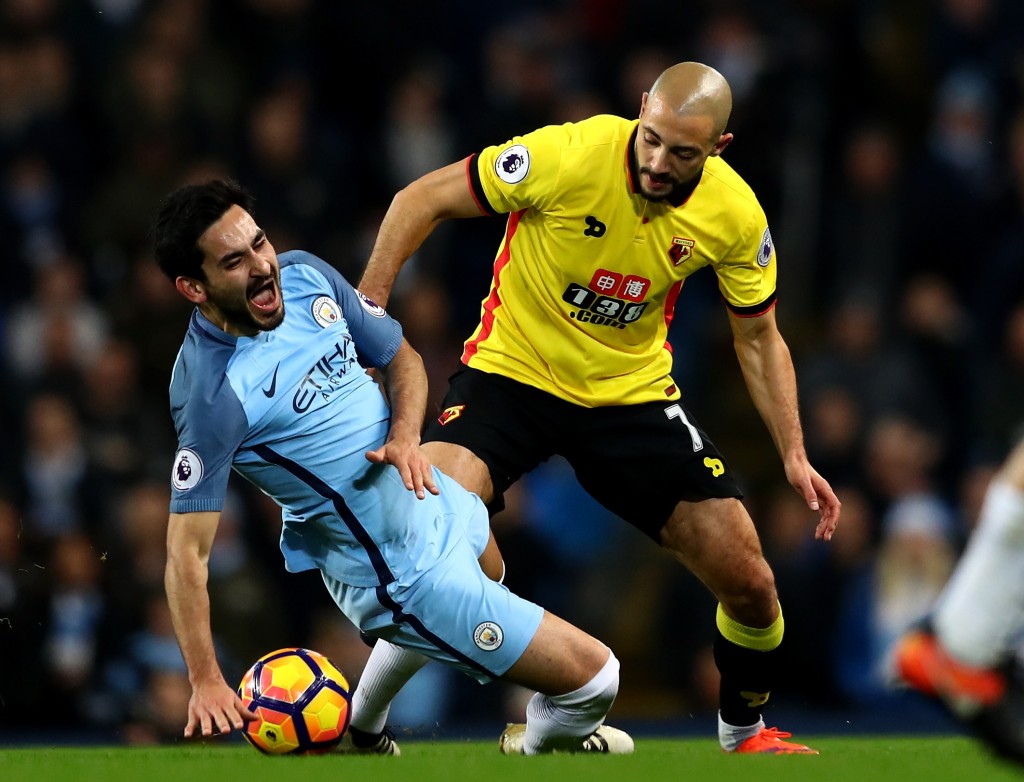 MANCHESTER, ENGLAND - DECEMBER 14: Ilkay Gundogan of Manchester City is challenged by Nordin Amrabat of Watford during the Premier League match between Manchester City and Watford at Etihad Stadium on December 14, 2016 in Manchester, England. (Photo by Michael Steele/Getty Images)