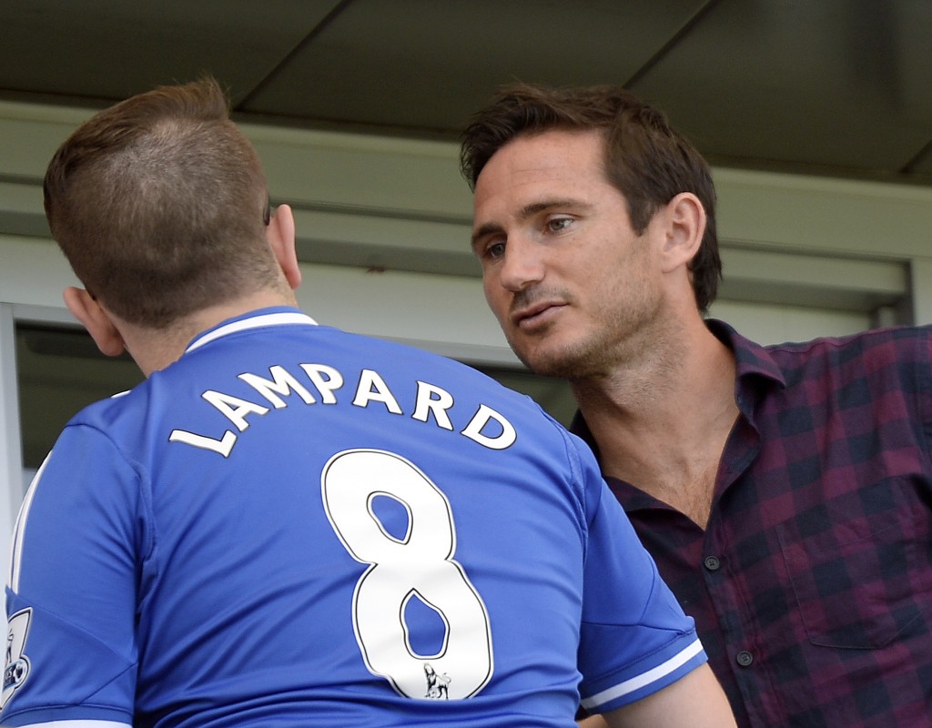 CARSON, CA - AUGUST 23: Injured Frank Lampard #8 of New York City FC greets a fan wearing a Chelsea jersey in a luxury box before the start of the Los Angeles Galaxy and New York City FC soccer match at StubHub Center August 23, 2015, in Carson, California. Lampard did not play as he recovers form a injury (Photo by Kevork Djansezian/Getty Images)