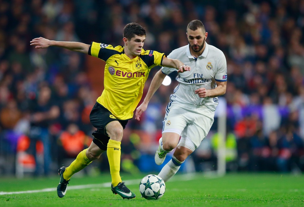 MADRID, SPAIN - DECEMBER 07: Christian Pulisic of Borussia Dortmund (L) and Karim Benzema of Real Madrid (R) battle for possession during the UEFA Champions League Group F match between Real Madrid CF and Borussia Dortmund at the Bernabeu on December 7, 2016 in Madrid, Spain. (Photo by Gonzalo Arroyo Moreno/Getty Images)