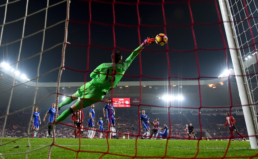 SUNDERLAND, ENGLAND - DECEMBER 14: Thibaut Courtois of Chelsea saves a shot by Patrick van Aanholt of Sunderland during the Premier League match between Sunderland and Chelsea at Stadium of Light on December 14, 2016 in Sunderland, England. (Photo by Laurence Griffiths/Getty Images)