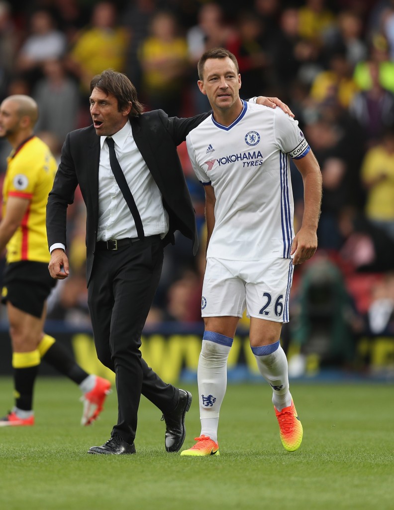 WATFORD, ENGLAND - AUGUST 20: Manager Antonio Conte and John Terry of Chelsea celebrate their victory during the Premier League match between Watford and Chelsea at Vicarage Road on August 20, 2016 in Watford, England. (Photo by Christopher Lee/Getty Images)