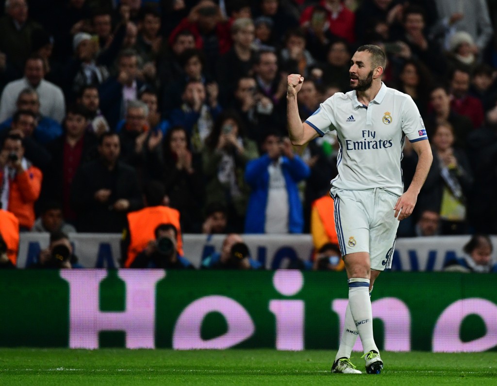 Real Madrid's French forward Karim Benzema celebrates a goal during the UEFA Champions League football match Real Madrid CF vs Borussia Dortmund at the Santiago Bernabeu stadium in Madrid on December 7, 2016. / AFP / PIERRE-PHILIPPE MARCOU        (Photo credit should read PIERRE-PHILIPPE MARCOU/AFP/Getty Images)