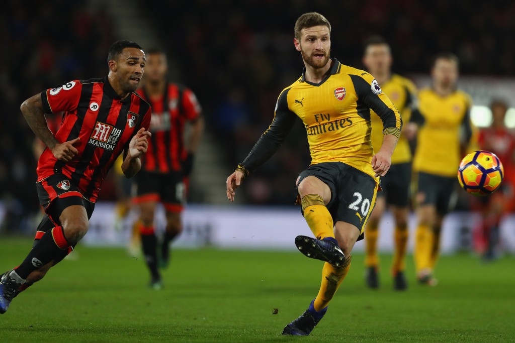 BOURNEMOUTH, ENGLAND - JANUARY 03: Shkodran Mustafi of Arsenal tracked by Callum Wilson of Bournemouth during the Premier League match between AFC Bournemouth and Arsenal at the Vitality Stadium on January 3, 2017 in Bournemouth, England. (Photo by Michael Steele/Getty Images,)