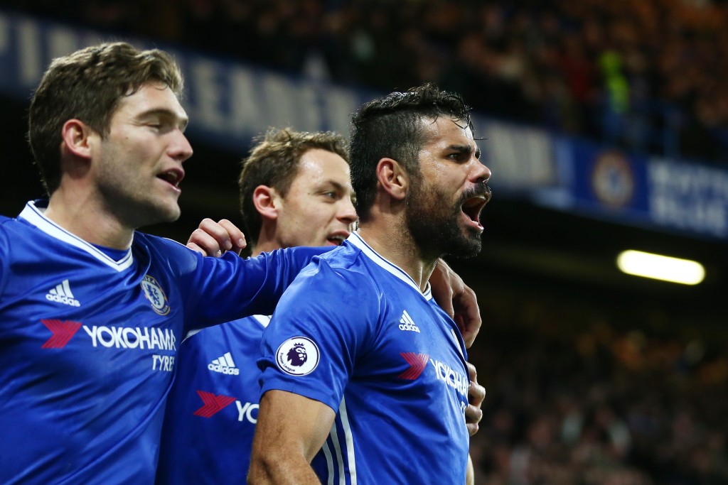 LONDON, ENGLAND - DECEMBER 31: Diego Costa (R) of Chelsea celebrates scoring his team's fourth goal with his team mates during the Premier League match between Chelsea and Stoke City at Stamford Bridge on December 31, 2016 in London, England. (Photo by Steve Bardens/Getty Images)